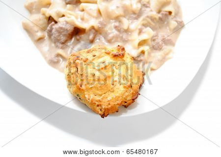 A Biscuit As A Side Dish Of A Gravy Pasta Dinner