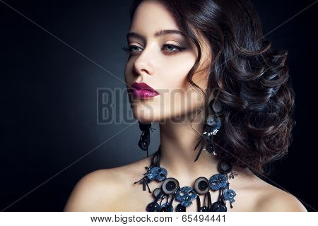 Close-up studio portrait of beautiful woman.