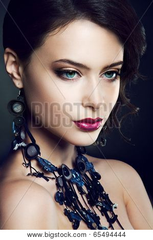 Close-up studio portrait of beautiful woman.