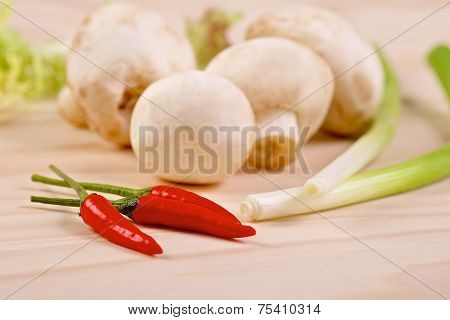 Red hot chilli peppers with mushrooms and scallion