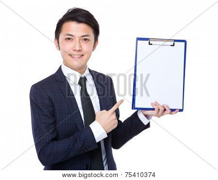 Businessman show thw blank paper of clipboard