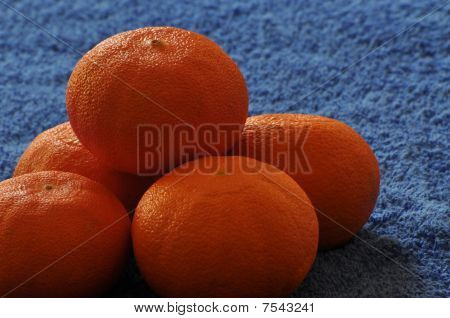 clementines in a blue background