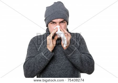 Ill man blowing his nose