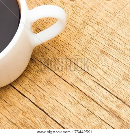 White Ceramic Coffee Cup On Wooden Table - View From Top