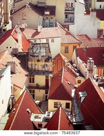 Houses with traditional red roofs in Prague Old Town Square in the Czech Republic