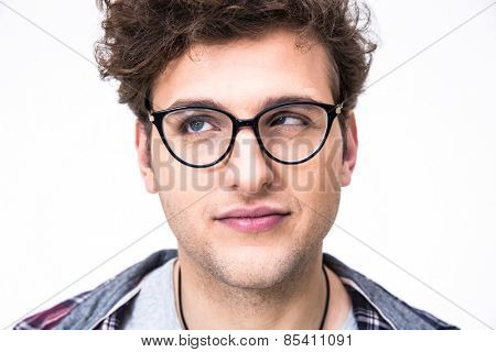 Closeup portrait of a funny man with curly hair over gray background