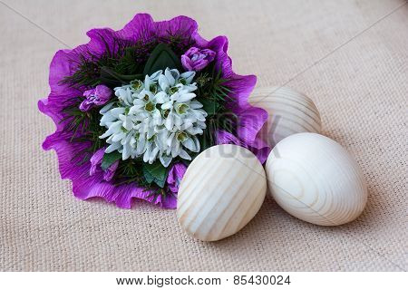 Snowdrop flowers and wooden eggs