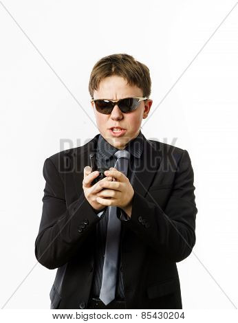 Teenage Boy Posing Like A Guardsman With Radio Transmitter