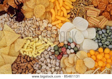 Savory snack food selection forming an abstract background.