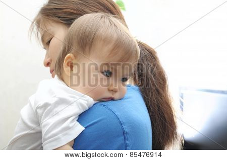 Baby Laying Head On Mother's Arm