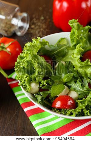 fresh vegetable salad in bowl on table close up