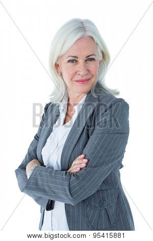 Confident businesswoman arms crossed on white background