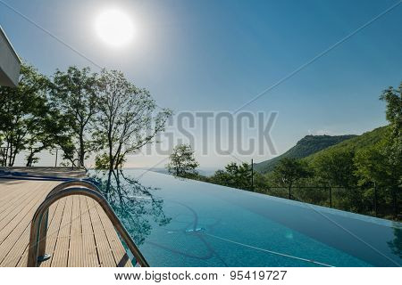 Infinity pool on the bright summer day