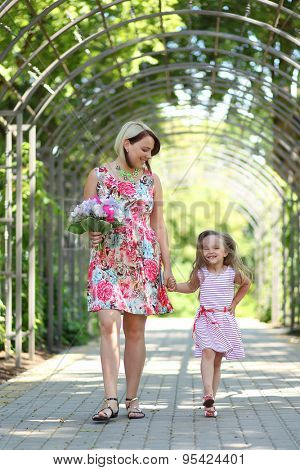 young mother with daughter in park