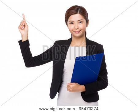 Businesswoman hodling with clipboard and finger point up