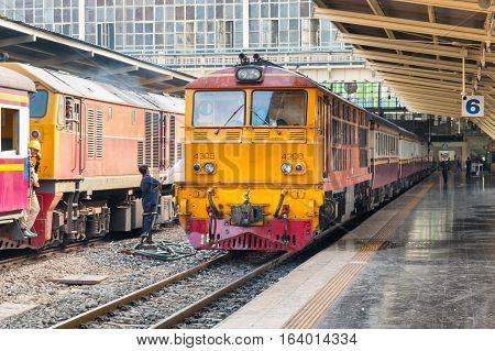 BANGKOK, THAILAND - DECEMBER 13, 2016: Trains waits at a platform of railway station Hua Lamphong in Bangkok. Hua Lamphong opened in 1916 and serves apprx 70,000 passengers and 150 trains each day.