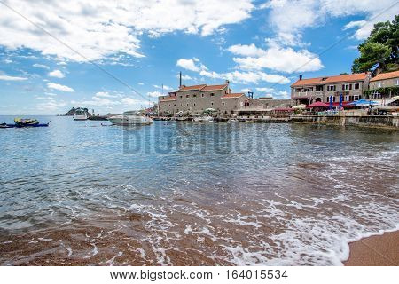 PETROVAC, MONTENEGRO - SEPTEMBER 20, 2016:The old town of Petrovac with an ancient fortress and a bay for tourist and fishing vessels, Montenegro.