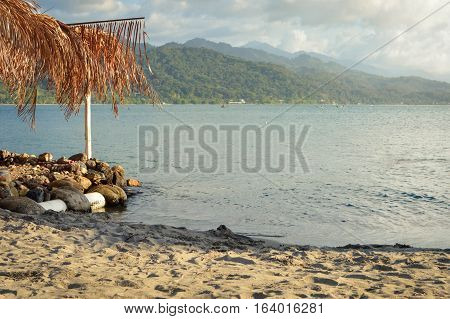 Roof made of dry palm leaves and the Caribbean coast by the little town of Omoa in Honduras. Central America