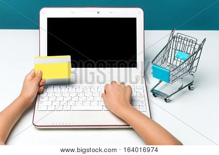 Using Laptop To Online Shopping And Pay By Credit Card. Vintage Tone, Retro Filter Effect. Business