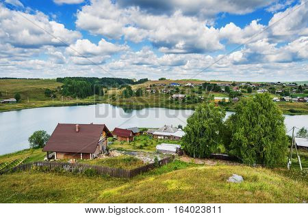 Summer rural landscape. Russia. Ural village Chusovoe founded in 1727 by Akinfy Demidov