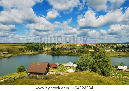 Summer rural landscape. Russia. Ural village Chusovoe founded in 1727 by Akinfy Demidov