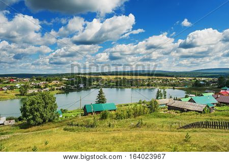 Summer rural landscape. Russia. Ural village Chusovoe founded in 1727 by Akinfy Demidov