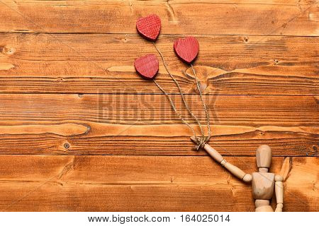 Gestalta Or Poppet Toy Holding Hearts