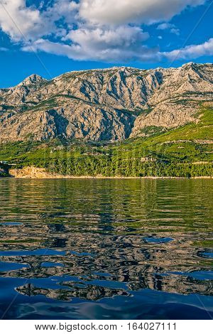 Tucepi landscape view from the boat towards the Biokovo mountain, Adriatic Sea Croatia.