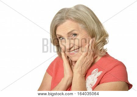 Portrait of a beautiful mature woman, posing agains white