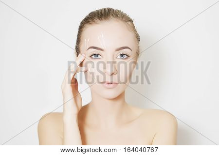 Closeup of female adult with marks on skin for cosmetic medical procedures