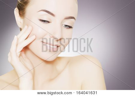 portrait of beautiful smiling woman with perfect skin
