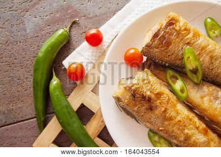 fried shad with chilli australian fish on plate