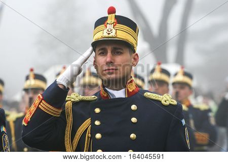 BUCHAREST ROMANIA - DECEMBER 1 2008: A military from the National Guard salutes during a military parade. More than 3000 soldiers and personnel from security agencies take part in the massive parades on National Day of Romania.