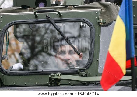 BUCHAREST ROMANIA - DECEMBER 1 2008: Soldiers are marching during a military parade in Bucharest. More than 3000 soldiers and personnel from security agencies take part in the massive parades on National Day of Romania.