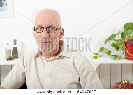 a portrait of handsome mature man with glasses