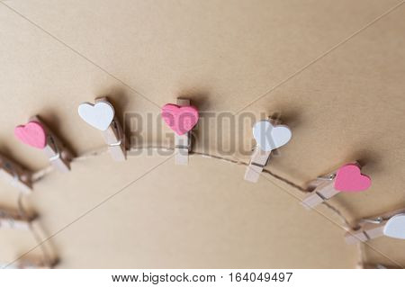 Clothespins with hearts are Notepad. Background is blue paper