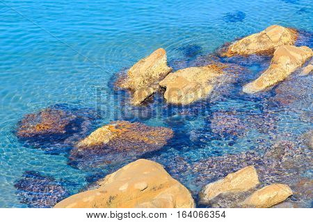 Stones In Clear Sea Water.