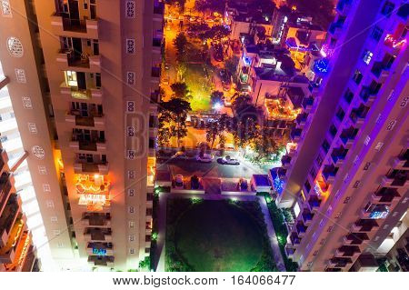 colorful lights on a skyscraper in Noida Delhi India on the eve of diwali. Urbanization of the city has given a rise to many residences
