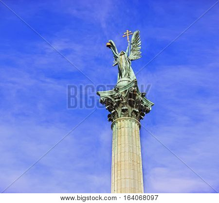 Statue On Top Of Column On Heroes Square In Budapest, Hungary Heroes' Square In The Summer On A Sunn