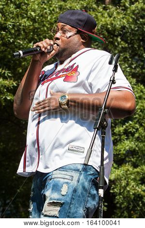 ATLANTA, GA - OCTOBER 2016:  An unidentified male artist performs on the stage at Atlanta Hip Hop Day a free festival open to the public at Woodruff Park in downtown Atlanta in Atlanta GA on October 8 2016.