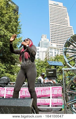 ATLANTA, GA - OCTOBER 2016:  Female hip hop artist Knocka DonDiva performs on the stage at Atlanta Hip Hop Day a free festival open to the public at Woodruff Park in downtown Atlanta in Atlanta GA on October 8 2016.