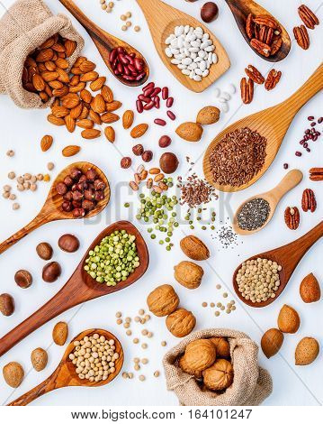 Various Legumes And Different Kinds Of Nuts In Spoons. Walnuts Kernels ,hazelnuts, Almond ,brown Pin