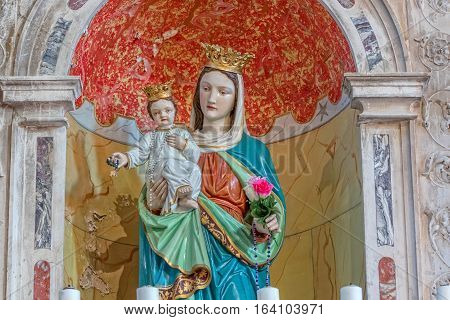 TUCEPI, CROATIA - September 21, 2016: Madonna with Child statue, part of the interior of the Church of St. Anthony in old village in Dalmatia.