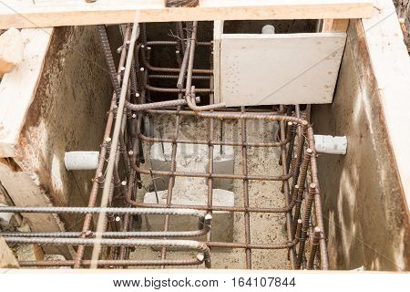 The concrete formwork and reinforcement steel for construction foundation.
