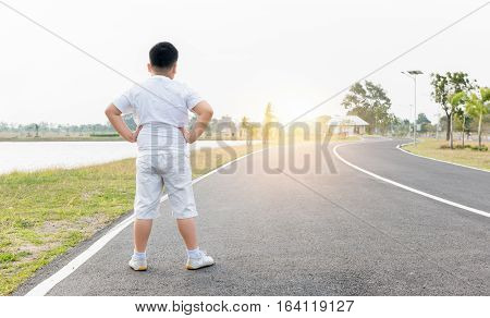 Obese Fat Boy Exercise At Park On Morning