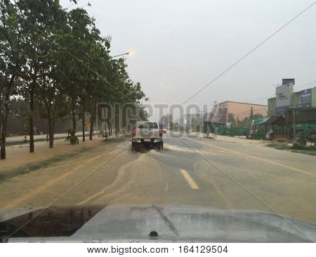 PATTALUNG, THAILAND, JAN 4, 2017: Water flooding on the street in Thailand