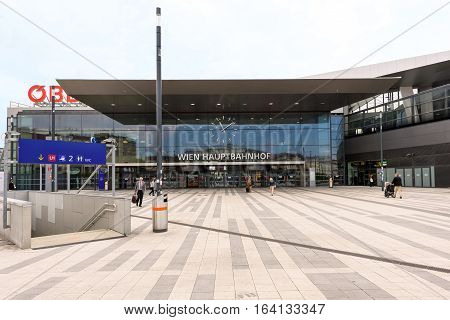 VIENNA, AUSTRIA - MAY 18, 2016: Facade of the main railway station of wien with OBB logo company and people