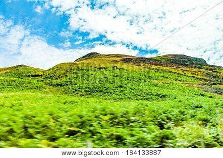landscapes of agricultural fields photographed from the car near blackford town in the Highlands Scotland