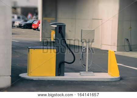Yellow and black gas station close up