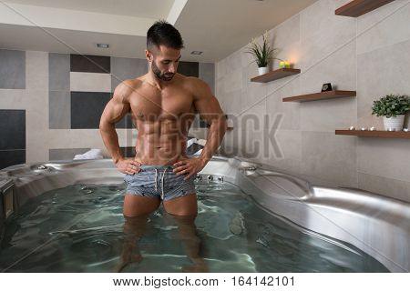 Flexing Muscles In Hot Tube Jacuzzi